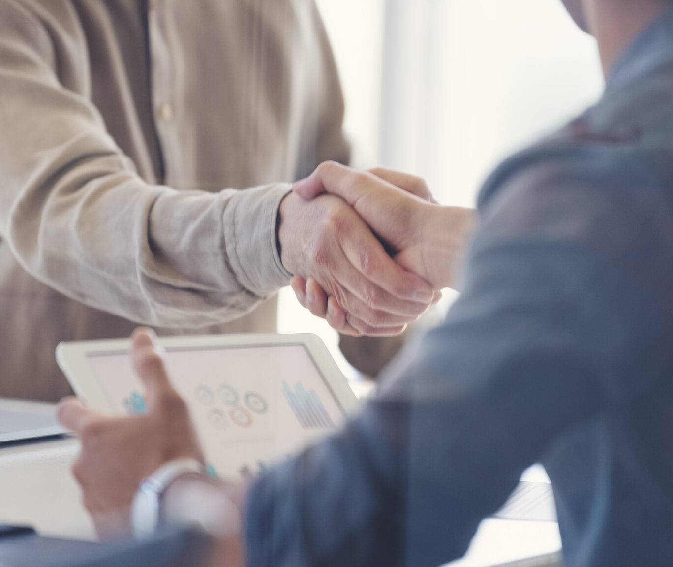 Close up of Businessmen shaking hands.