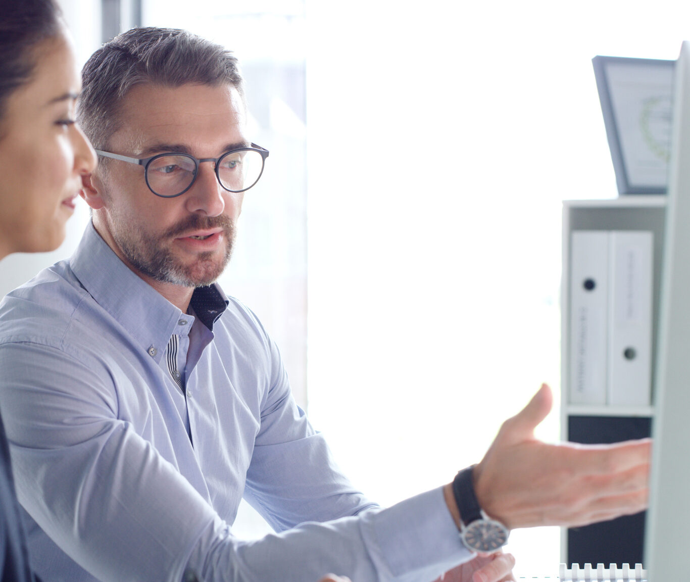 Shot of two businesspeople working together on a computer in an office